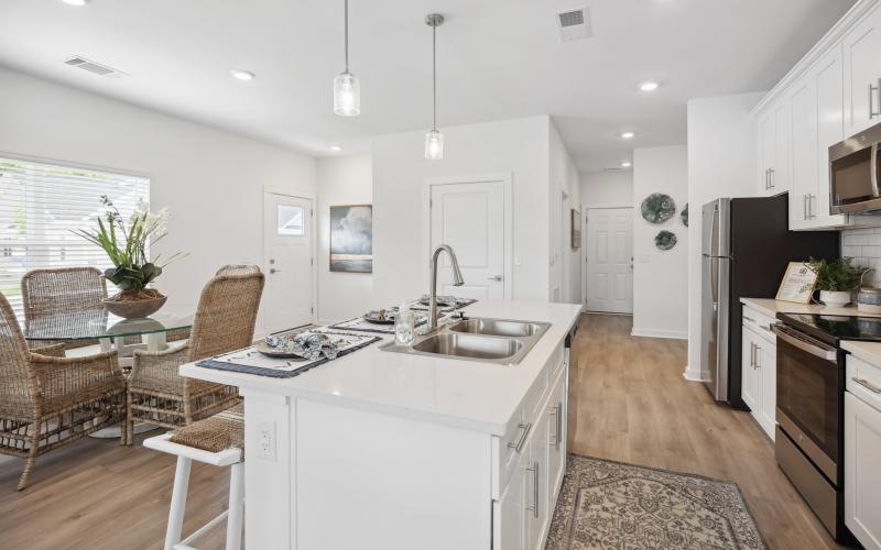 a kitchen with a white island