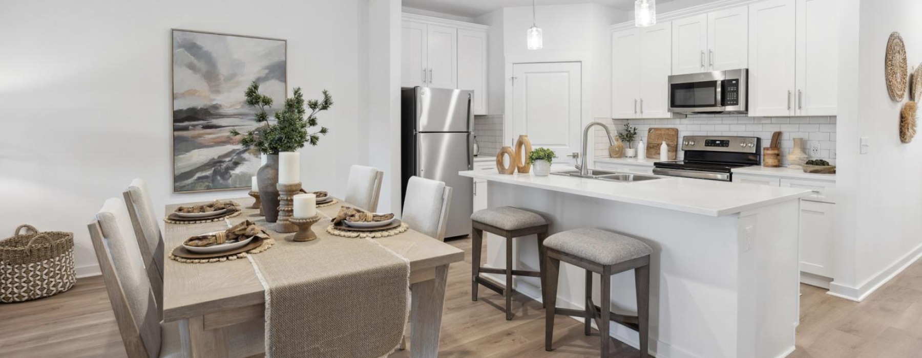 a kitchen with a dining table and chairs