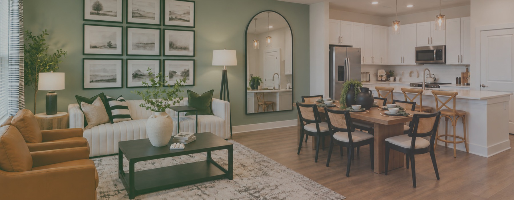 Model living room at River Rock at Dallas rental home community in Dallas, NC, featuring wood grain floor paneling.