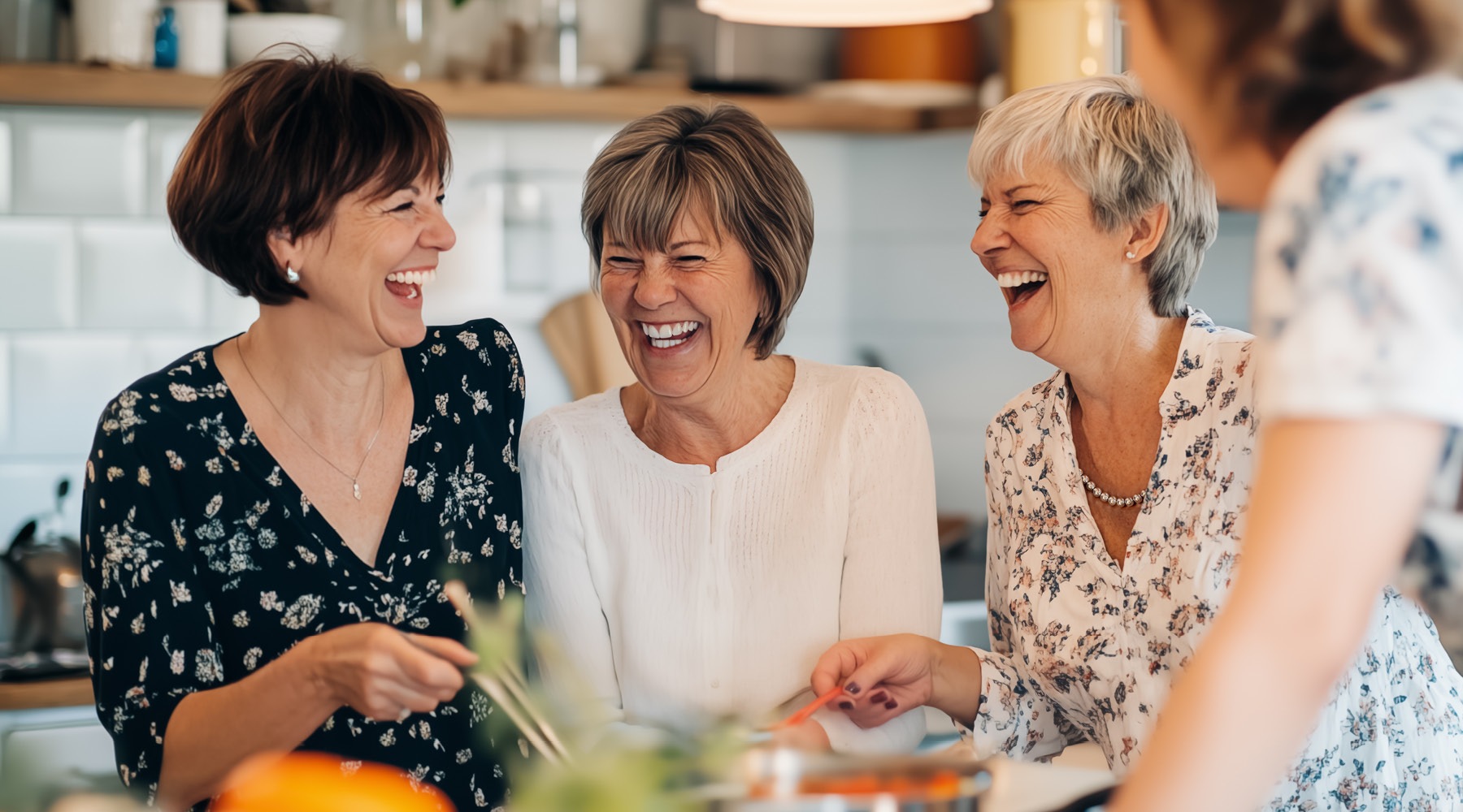 Two residents laughing and smiling at River Rock at Dallas rental home community in Dallas, NC, featuring natural lighting.